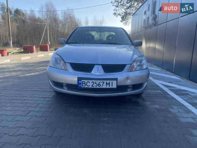 Серый Мицубиси Лансер, объемом двигателя 1.58 л и пробегом 270 тыс. км за 3999 $, фото 1 на Automoto.ua