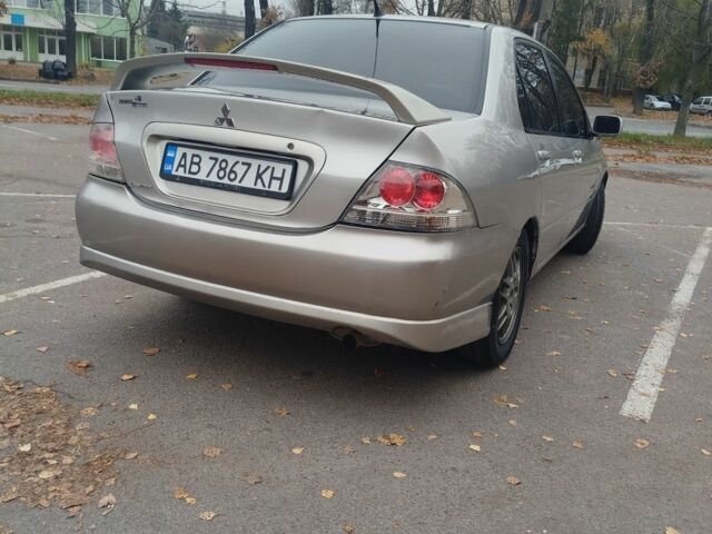 Сірий Міцубісі Lancer, об'ємом двигуна 2 л та пробігом 330 тис. км за 3450 $, фото 2 на Automoto.ua