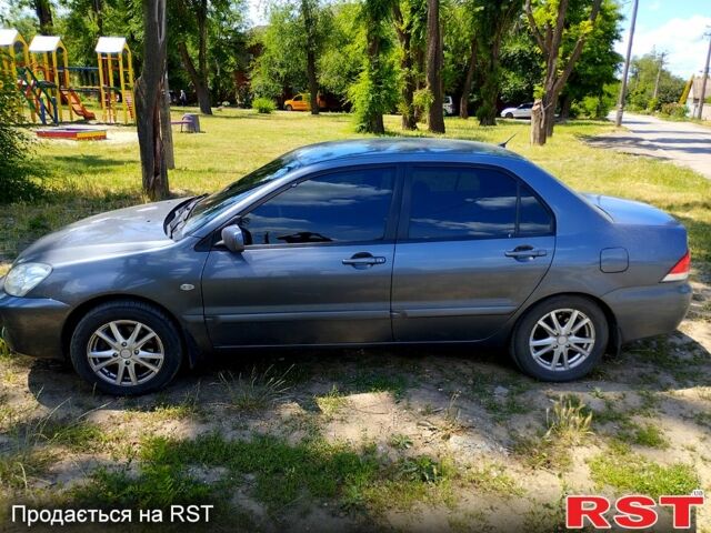 Серый Мицубиси Лансер, объемом двигателя 1.6 л и пробегом 214 тыс. км за 4500 $, фото 8 на Automoto.ua