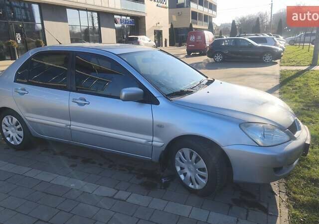 Сірий Міцубісі Lancer, об'ємом двигуна 1.6 л та пробігом 206 тис. км за 3800 $, фото 6 на Automoto.ua
