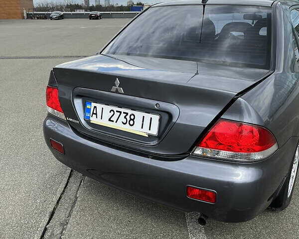 Сірий Міцубісі Lancer, об'ємом двигуна 1.6 л та пробігом 260 тис. км за 4998 $, фото 15 на Automoto.ua