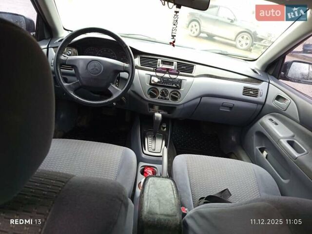 Сірий Міцубісі Lancer, об'ємом двигуна 2 л та пробігом 212 тис. км за 3333 $, фото 8 на Automoto.ua