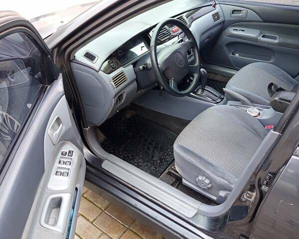 Сірий Міцубісі Lancer, об'ємом двигуна 2 л та пробігом 212 тис. км за 3333 $, фото 11 на Automoto.ua