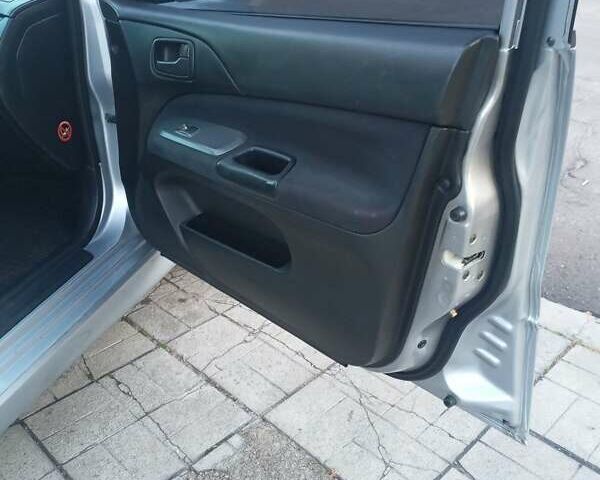 Мицубиси Лансер 2006 в Каменское - Днепродзержинск на Automoto.ua Серый Мицубиси Лансер, объемом двигателя 1.58 л и пробегом 238 тыс. км за 5400 $, фото 6 на Automoto.ua