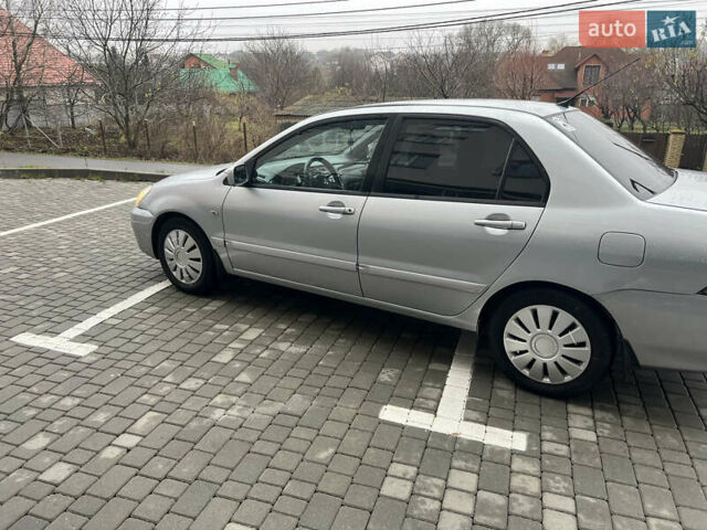 Серый Мицубиси Лансер, объемом двигателя 1.58 л и пробегом 333 тыс. км за 2600 $, фото 8 на Automoto.ua