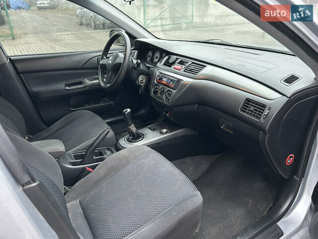 Сірий Міцубісі Lancer, об'ємом двигуна 1.6 л та пробігом 223 тис. км за 3900 $, фото 10 на Automoto.ua