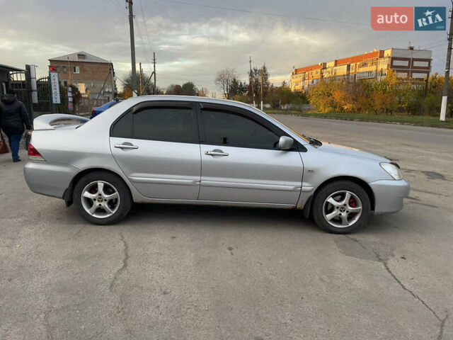 Сірий Міцубісі Lancer, об'ємом двигуна 1.58 л та пробігом 430 тис. км за 2550 $, фото 8 на Automoto.ua