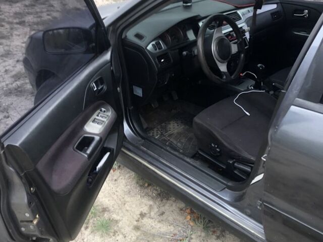 Міцубісі Lancer 2006 у Синельниковом на Automoto.ua Сірий Міцубісі Lancer, об'ємом двигуна 2 л та пробігом 200 тис. км за 3000 $, фото 3 на Automoto.ua
