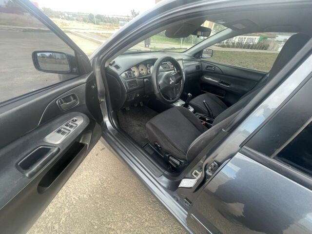 Серый Мицубиси Лансер, объемом двигателя 1.6 л и пробегом 162 тыс. км за 4650 $, фото 5 на Automoto.ua