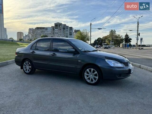 Сірий Міцубісі Lancer, об'ємом двигуна 1.58 л та пробігом 267 тис. км за 3999 $, фото 5 на Automoto.ua