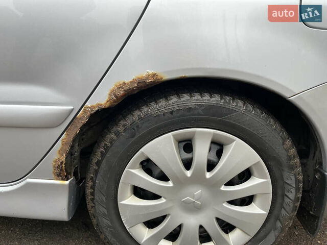 Сірий Міцубісі Lancer, об'ємом двигуна 1.58 л та пробігом 308 тис. км за 3700 $, фото 14 на Automoto.ua