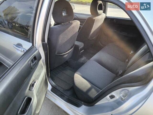 Серый Мицубиси Лансер, объемом двигателя 1.6 л и пробегом 344 тыс. км за 3400 $, фото 1 на Automoto.ua