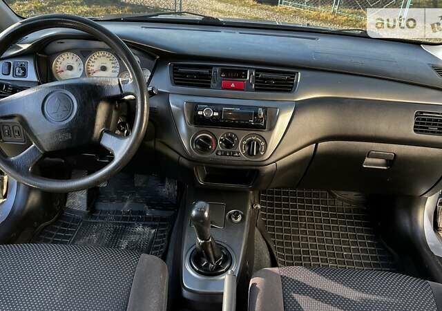 Сірий Міцубісі Lancer, об'ємом двигуна 1.6 л та пробігом 170 тис. км за 4200 $, фото 18 на Automoto.ua