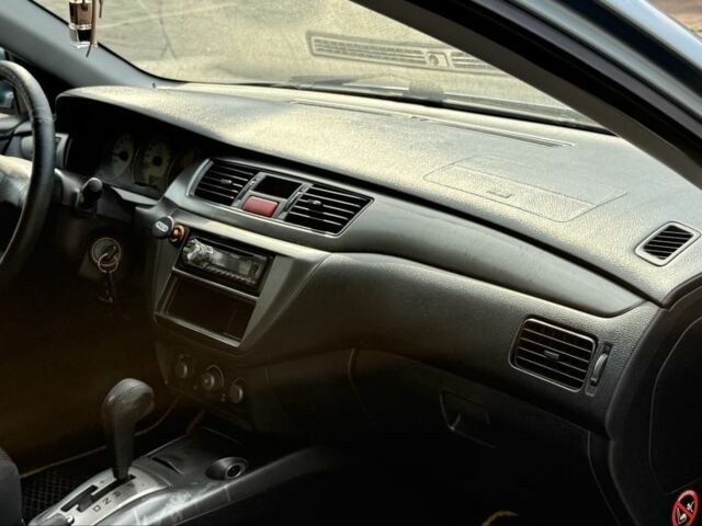 Серый Мицубиси Лансер, объемом двигателя 1.6 л и пробегом 220 тыс. км за 4400 $, фото 13 на Automoto.ua