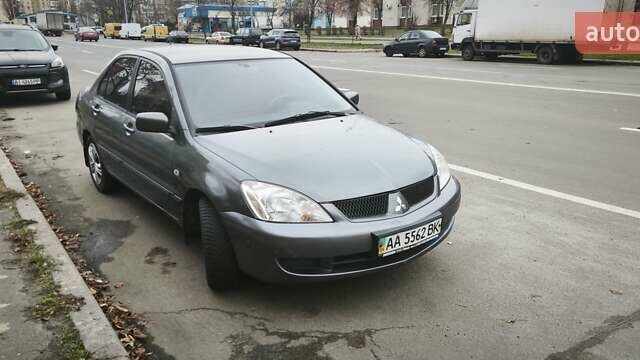 Серый Мицубиси Лансер, объемом двигателя 1.6 л и пробегом 263 тыс. км за 3650 $, фото 1 на Automoto.ua