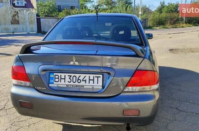 Сірий Міцубісі Lancer, об'ємом двигуна 1.6 л та пробігом 229 тис. км за 4900 $, фото 10 на Automoto.ua