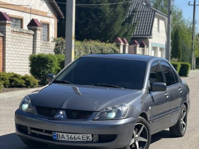 Серый Мицубиси Лансер, объемом двигателя 1.6 л и пробегом 284 тыс. км за 3500 $, фото 1 на Automoto.ua