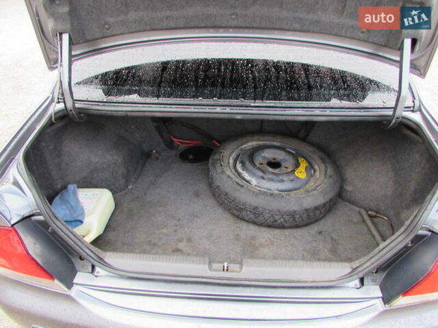 Серый Мицубиси Лансер, объемом двигателя 1.58 л и пробегом 300 тыс. км за 3600 $, фото 11 на Automoto.ua