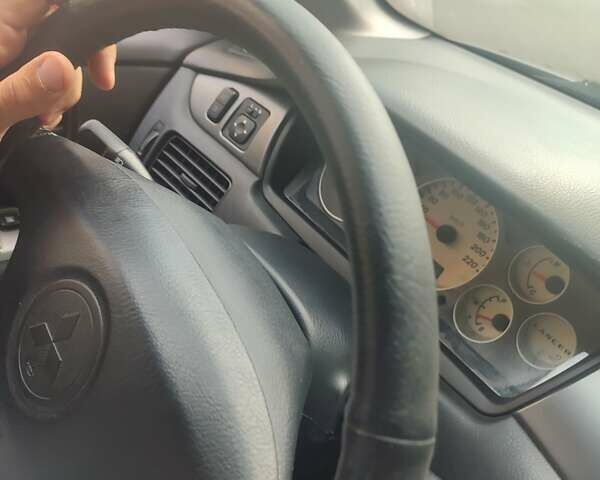 Сірий Міцубісі Lancer, об'ємом двигуна 1.6 л та пробігом 242 тис. км за 4900 $, фото 27 на Automoto.ua