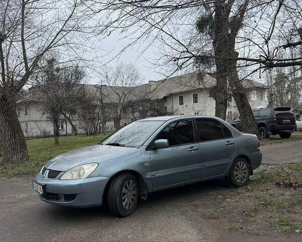 Сірий Міцубісі Lancer, об'ємом двигуна 1.6 л та пробігом 240 тис. км за 3000 $, фото 12 на Automoto.ua