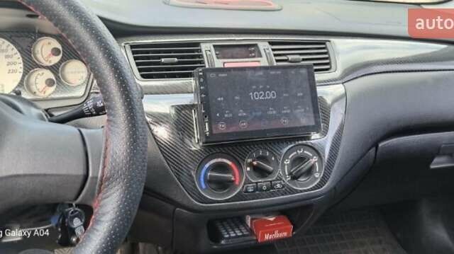 Серый Мицубиси Лансер, объемом двигателя 1.58 л и пробегом 271 тыс. км за 4600 $, фото 6 на Automoto.ua