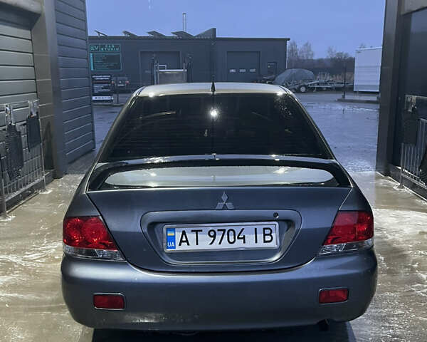 Серый Мицубиси Лансер, объемом двигателя 1.6 л и пробегом 213 тыс. км за 4500 $, фото 5 на Automoto.ua