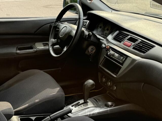 Серый Мицубиси Лансер, объемом двигателя 1.6 л и пробегом 220 тыс. км за 4400 $, фото 10 на Automoto.ua