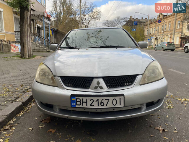 Серый Мицубиси Лансер, объемом двигателя 1.6 л и пробегом 444 тыс. км за 3400 $, фото 1 на Automoto.ua