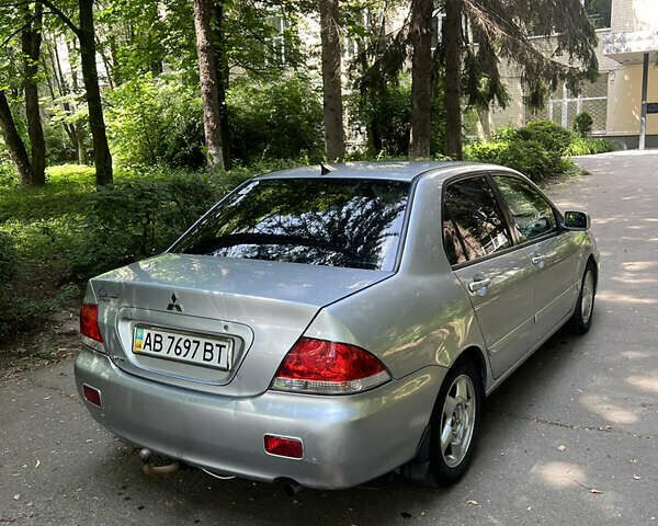 Серый Мицубиси Лансер, объемом двигателя 1.6 л и пробегом 330 тыс. км за 3200 $, фото 3 на Automoto.ua