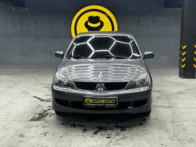 Серый Мицубиси Лансер, объемом двигателя 1.6 л и пробегом 300 тыс. км за 4600 $, фото 1 на Automoto.ua