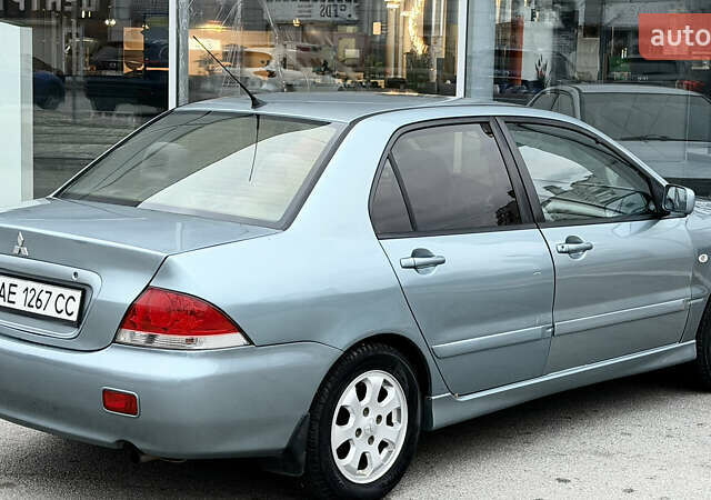 Сірий Міцубісі Lancer, об'ємом двигуна 1.58 л та пробігом 275 тис. км за 4600 $, фото 4 на Automoto.ua