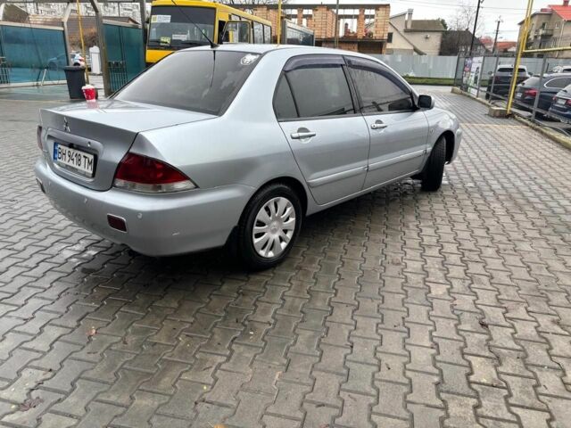 Серый Мицубиси Лансер, объемом двигателя 1.6 л и пробегом 260 тыс. км за 4999 $, фото 1 на Automoto.ua