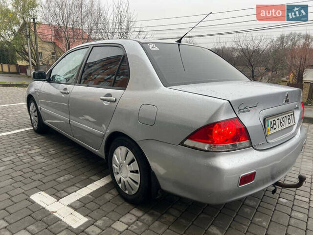 Сірий Міцубісі Lancer, об'ємом двигуна 1.58 л та пробігом 333 тис. км за 2999 $, фото 4 на Automoto.ua