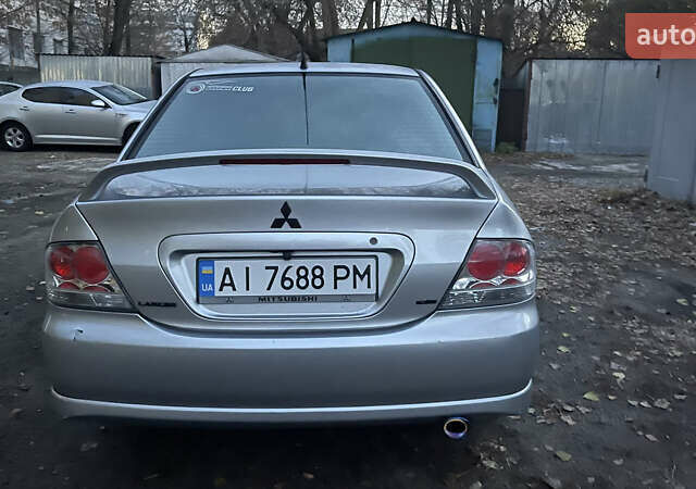 Серый Мицубиси Лансер, объемом двигателя 2 л и пробегом 307 тыс. км за 3999 $, фото 13 на Automoto.ua