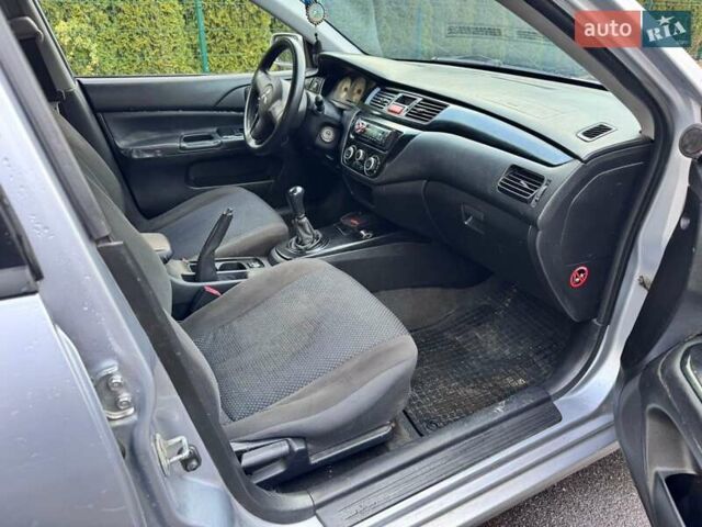Сірий Міцубісі Lancer, об'ємом двигуна 1.58 л та пробігом 333 тис. км за 2999 $, фото 11 на Automoto.ua
