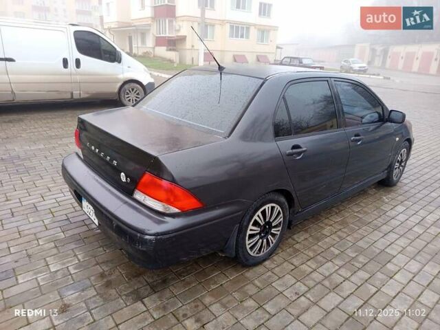 Серый Мицубиси Лансер, объемом двигателя 2 л и пробегом 215 тыс. км за 2900 $, фото 2 на Automoto.ua