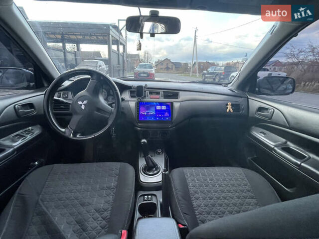 Серый Мицубиси Лансер, объемом двигателя 1.6 л и пробегом 213 тыс. км за 4500 $, фото 7 на Automoto.ua