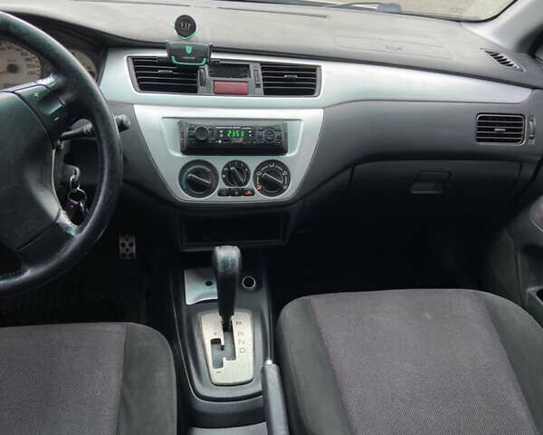 Мицубиси Лансер 2006 в Погребище на Automoto.ua Серый Мицубиси Лансер, объемом двигателя 2 л и пробегом 320 тыс. км за 3300 $, фото 9 на Automoto.ua