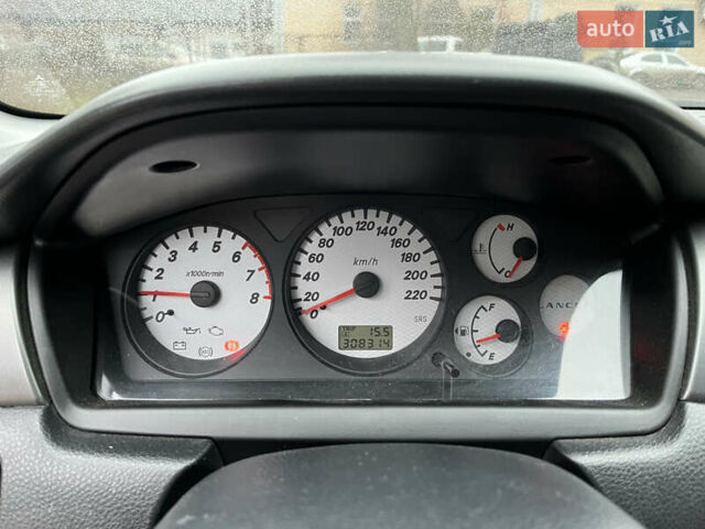 Сірий Міцубісі Lancer, об'ємом двигуна 1.58 л та пробігом 308 тис. км за 3700 $, фото 18 на Automoto.ua