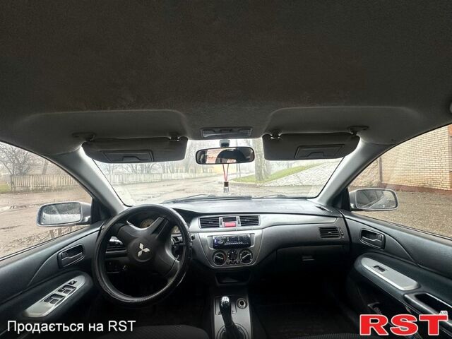 Серый Мицубиси Лансер, объемом двигателя 1.6 л и пробегом 123 тыс. км за 4000 $, фото 3 на Automoto.ua