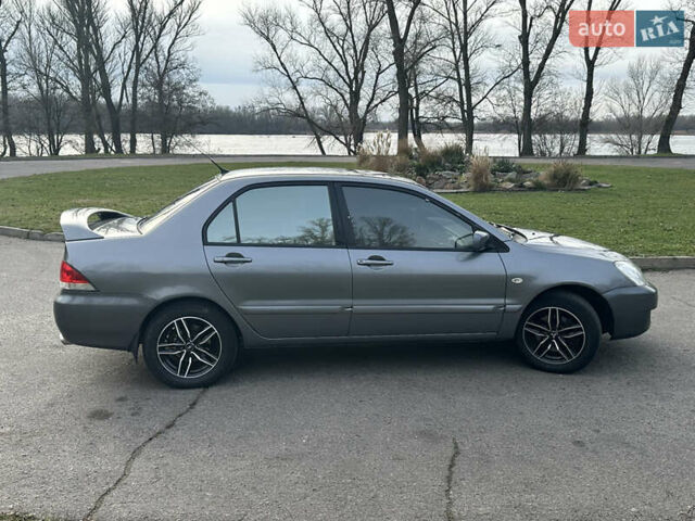 Сірий Міцубісі Lancer, об'ємом двигуна 1.58 л та пробігом 332 тис. км за 4650 $, фото 6 на Automoto.ua