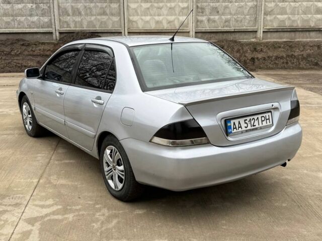 Сірий Міцубісі Lancer, об'ємом двигуна 1.6 л та пробігом 220 тис. км за 2450 $, фото 3 на Automoto.ua