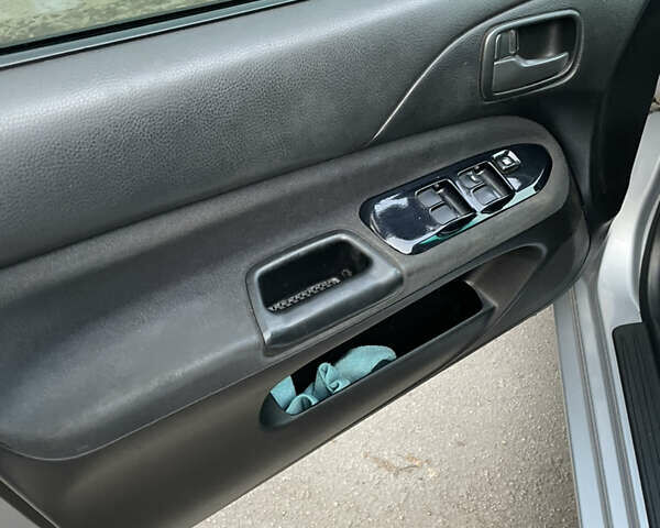 Сірий Міцубісі Lancer, об'ємом двигуна 1.58 л та пробігом 430 тис. км за 2550 $, фото 14 на Automoto.ua