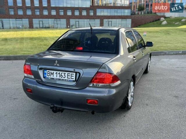 Сірий Міцубісі Lancer, об'ємом двигуна 1.58 л та пробігом 267 тис. км за 3999 $, фото 7 на Automoto.ua