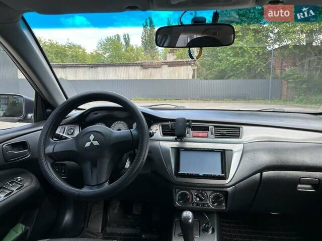 Сірий Міцубісі Lancer, об'ємом двигуна 1.58 л та пробігом 160 тис. км за 4600 $, фото 3 на Automoto.ua