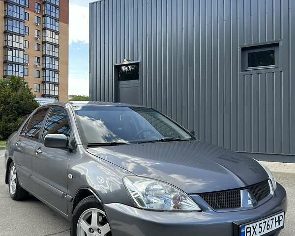 Сірий Міцубісі Lancer, об'ємом двигуна 1.58 л та пробігом 160 тис. км за 4600 $, фото 18 на Automoto.ua