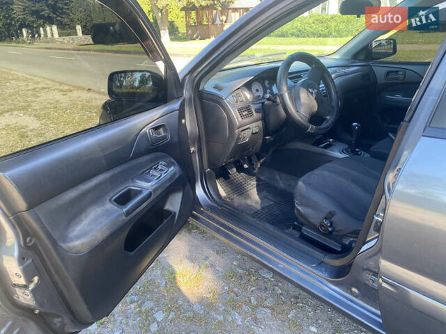 Серый Мицубиси Лансер, объемом двигателя 1.6 л и пробегом 291 тыс. км за 3900 $, фото 6 на Automoto.ua