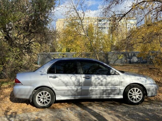 Серый Мицубиси Лансер, объемом двигателя 1.6 л и пробегом 204 тыс. км за 3999 $, фото 3 на Automoto.ua