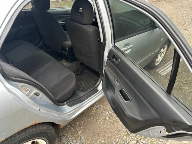 Сірий Міцубісі Lancer, об'ємом двигуна 1.6 л та пробігом 270 тис. км за 2900 $, фото 12 на Automoto.ua