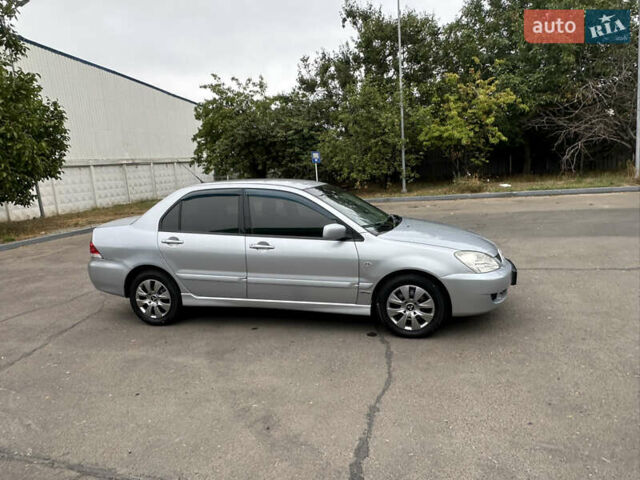 Серый Мицубиси Лансер, объемом двигателя 1.58 л и пробегом 183 тыс. км за 4800 $, фото 16 на Automoto.ua